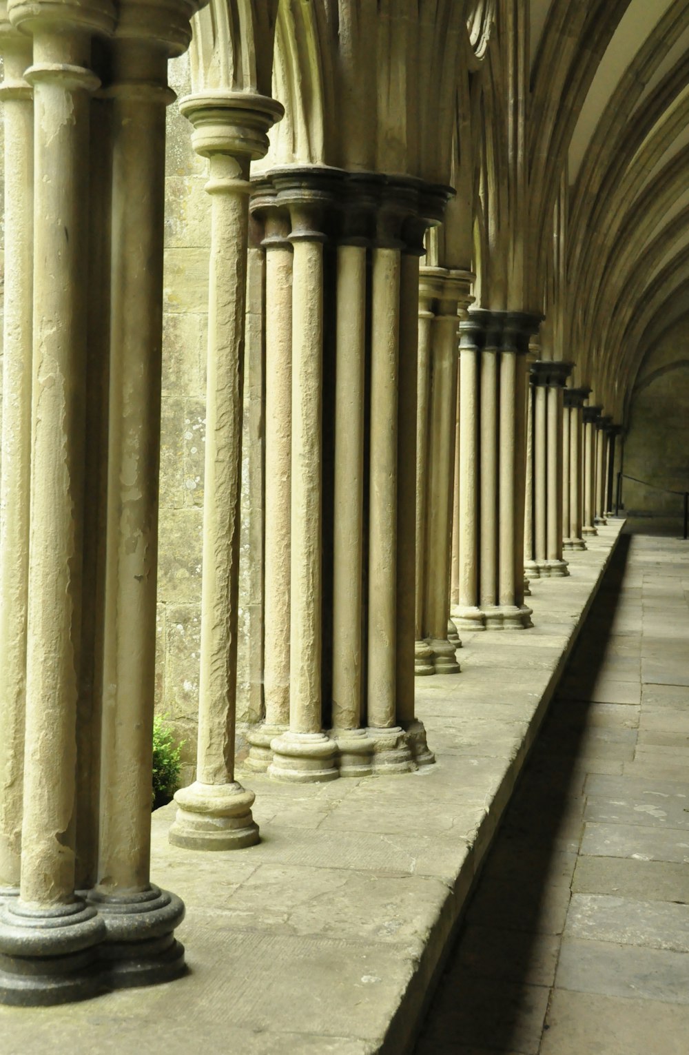 a row of stone pillars in a building