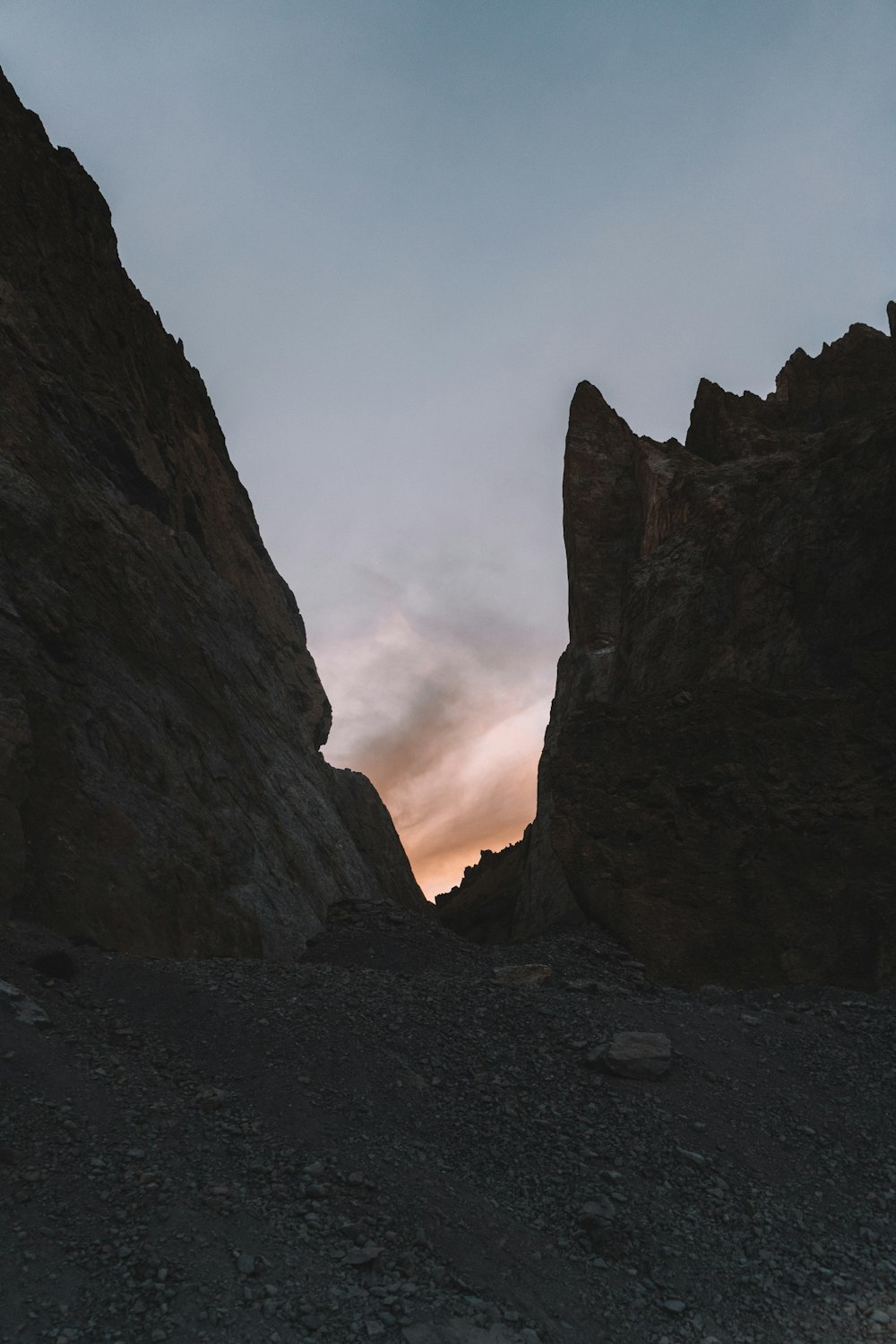 a couple of large rocks sitting in the middle of a desert