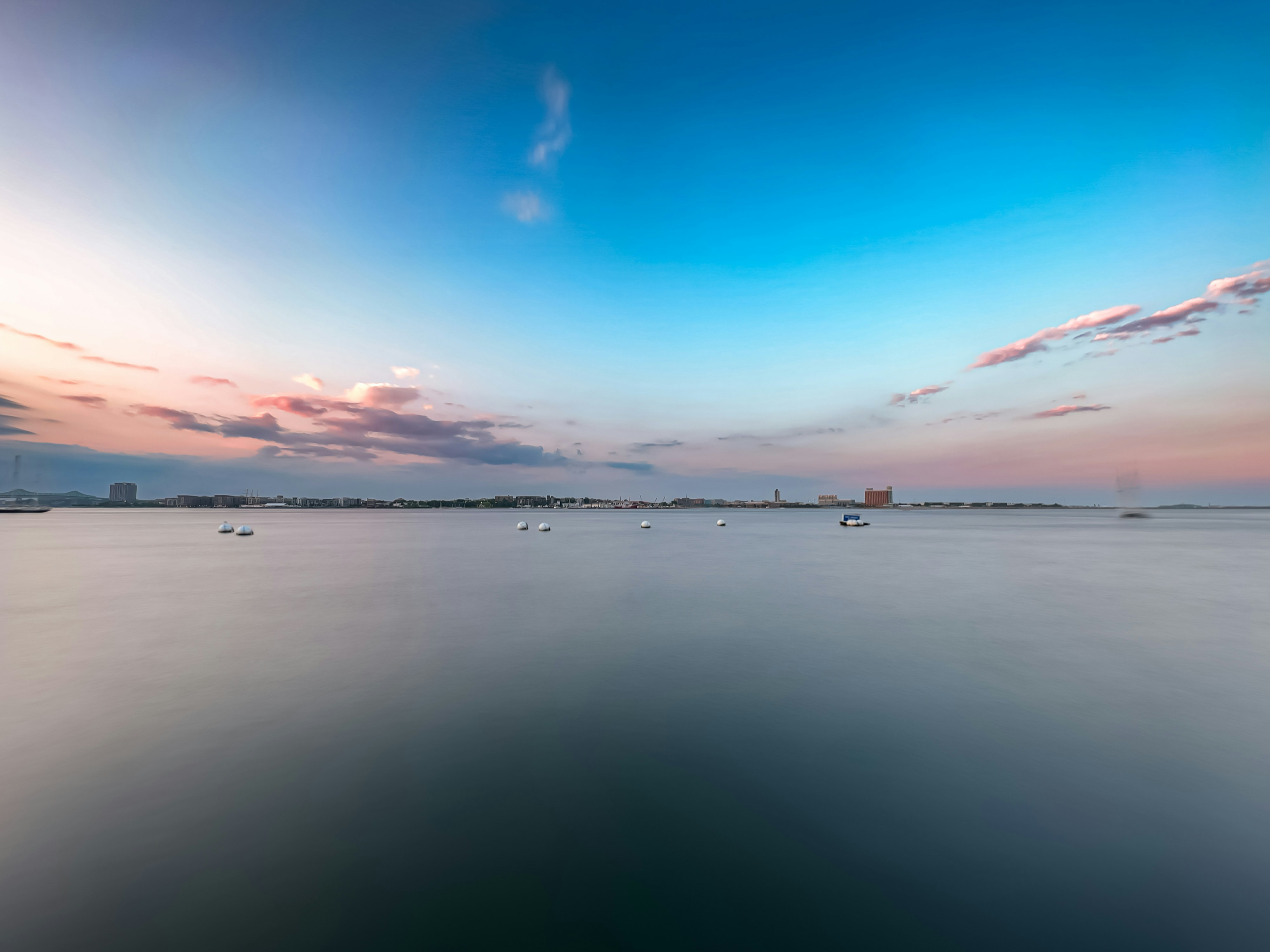 a large body of water with boats floating on it