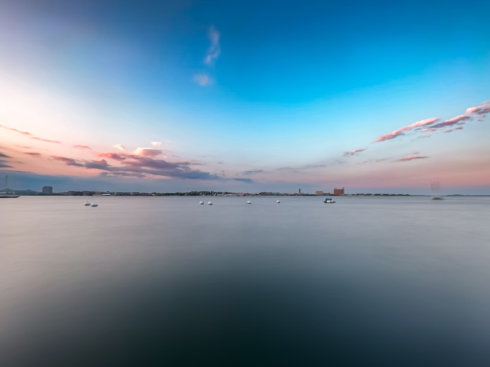 a large body of water with boats floating on it