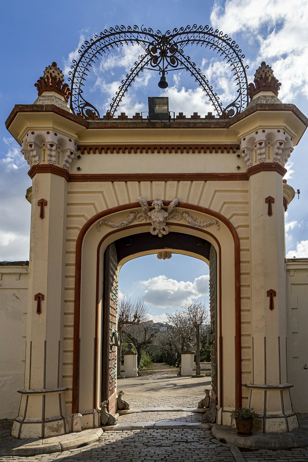 a gate with a clock on top of it