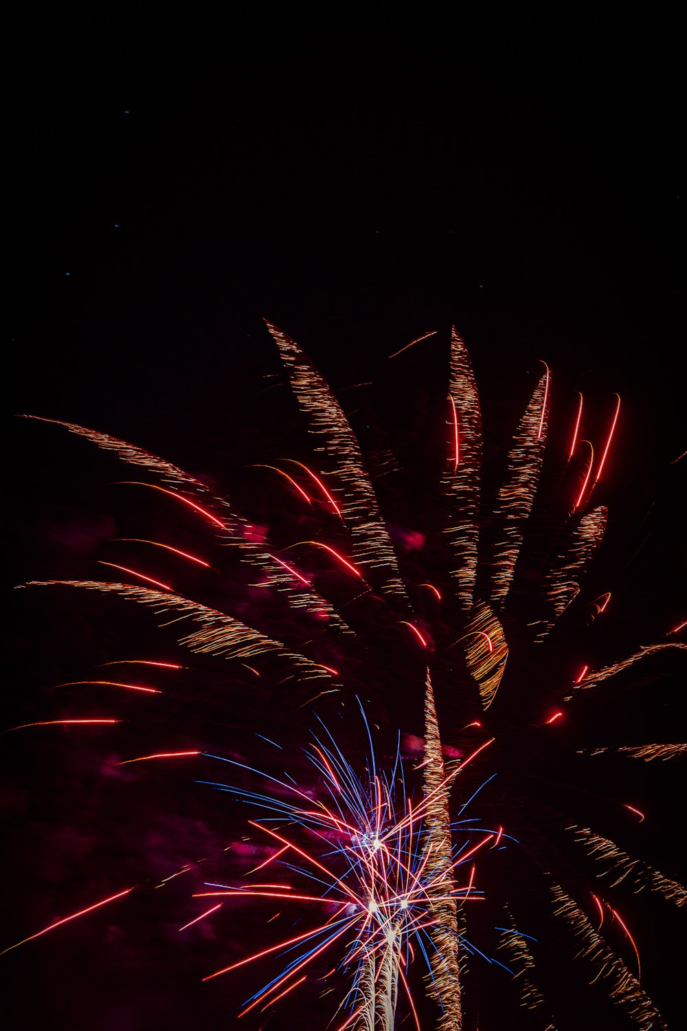 a colorful fireworks display in the night sky