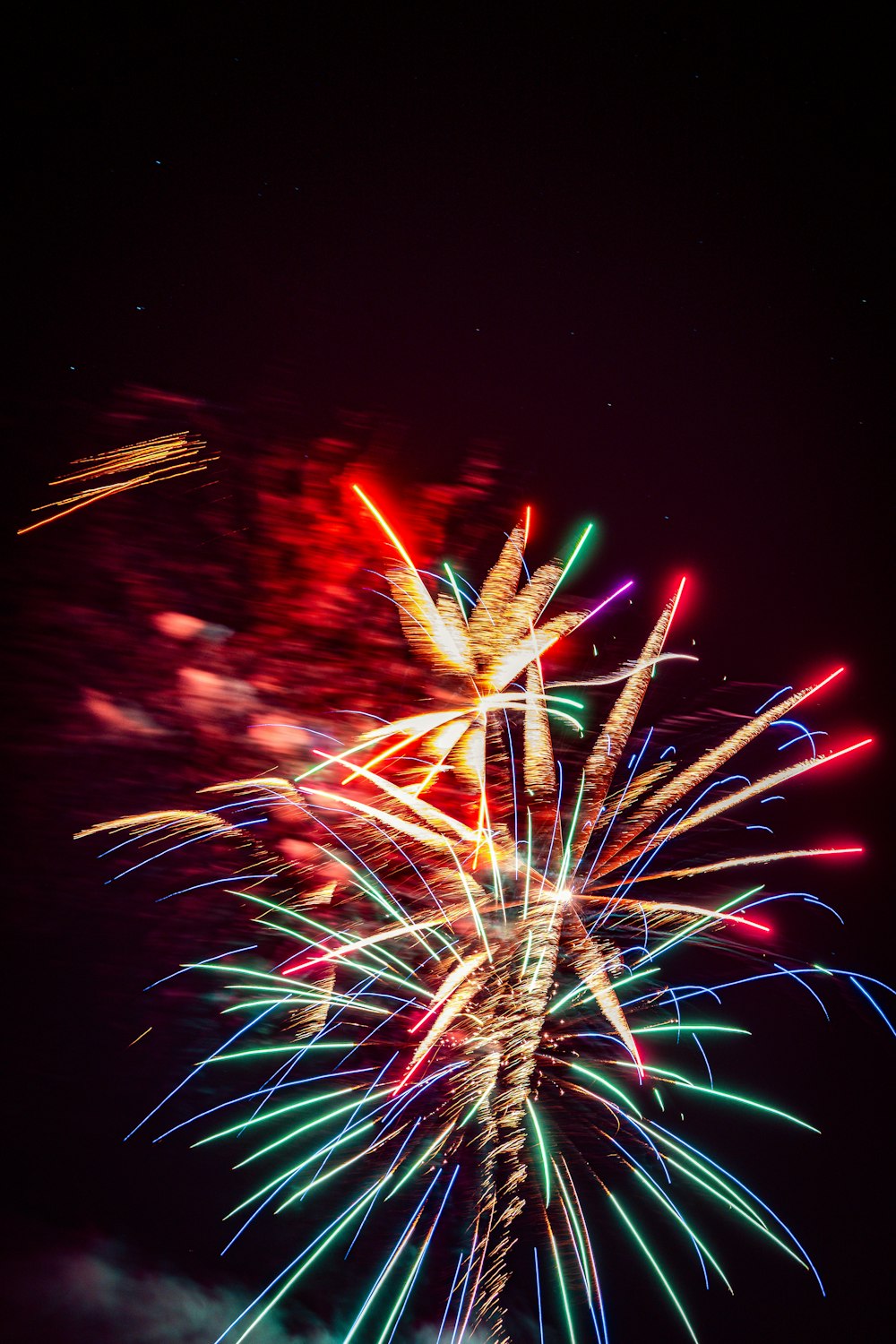 a colorful fireworks display in the night sky