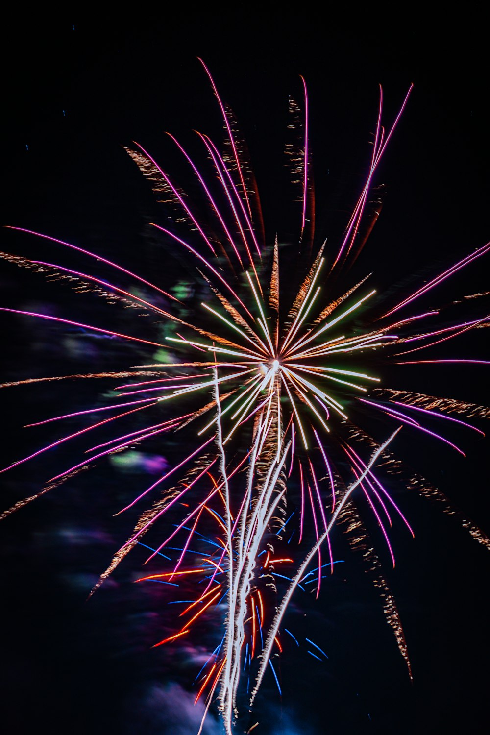 a colorful fireworks display in the night sky