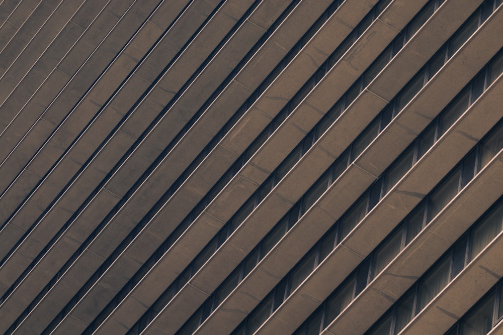 a plane flying in the air over a building