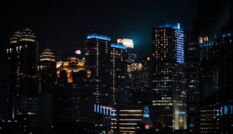 A digital cityscape illuminated by neon orange and blue lights.