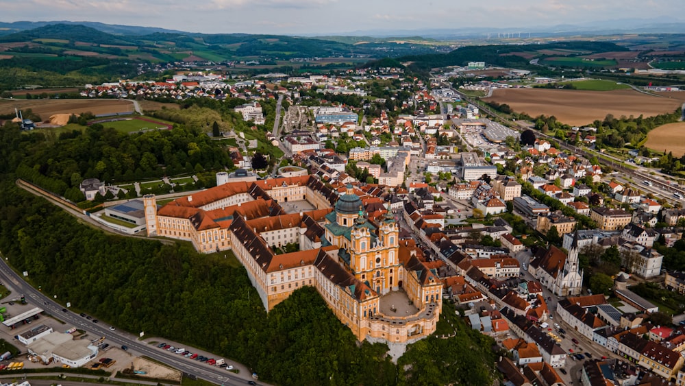 an aerial view of a city with a large church