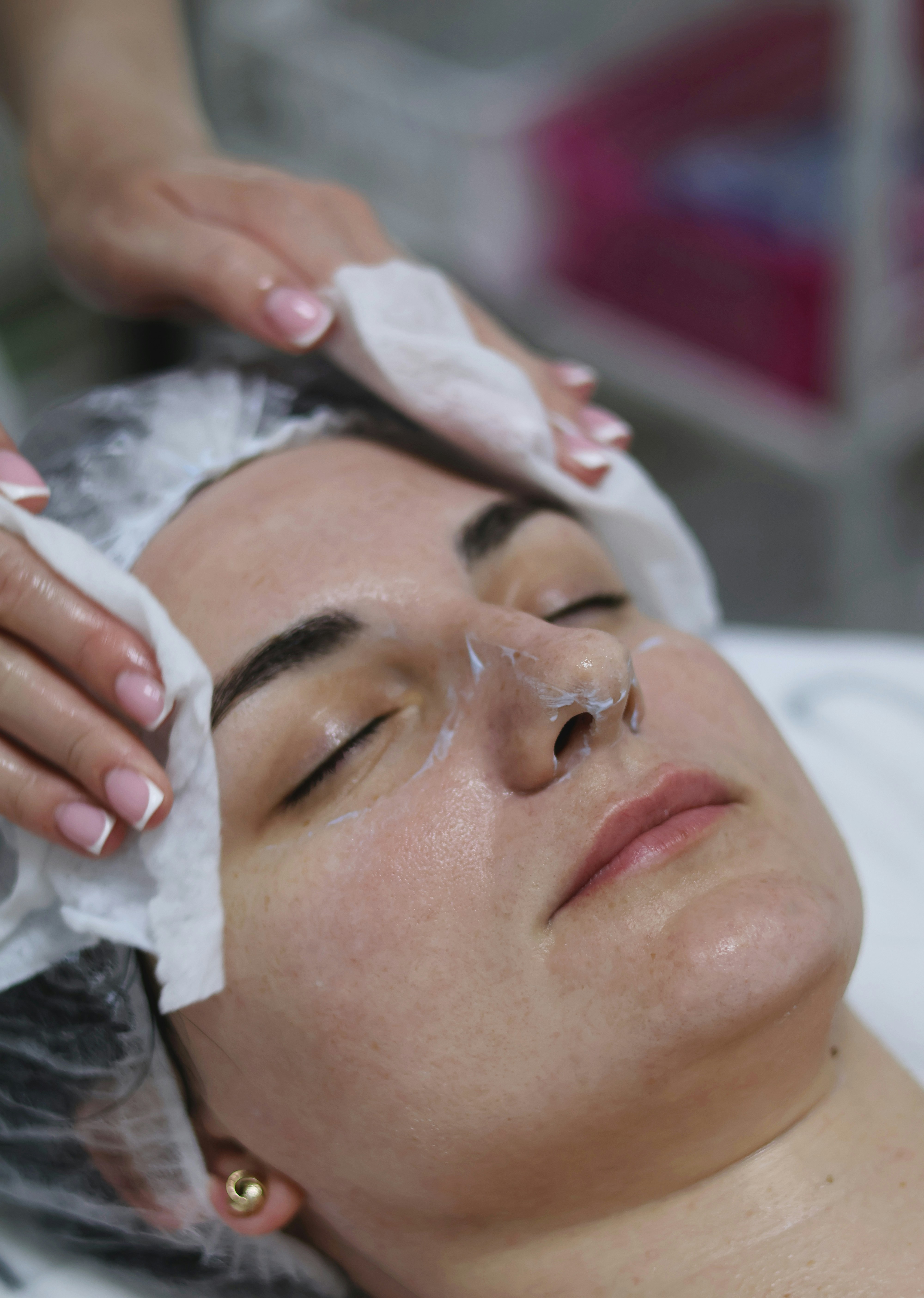 Basic facial cleansing treatment with gentle products applied to a womans face