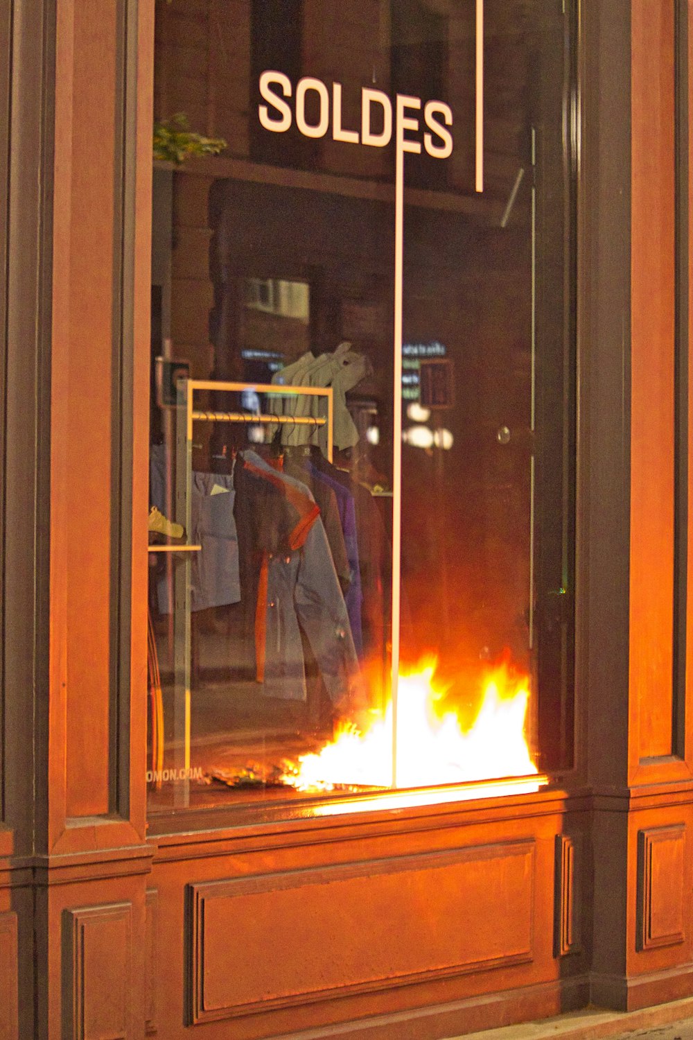 a fire is burning in a store window
