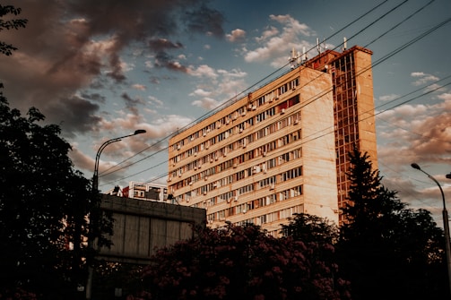 A residential building featuring skylights made from bipv solar glass glowing warmly at sunset.