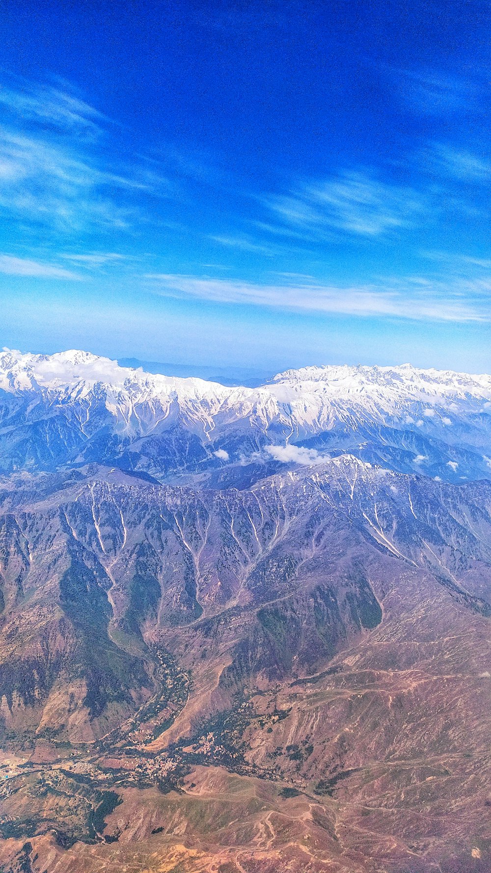 a view of a mountain range from an airplane