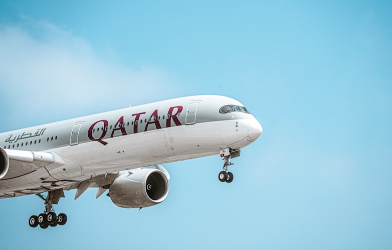 Large jetliner flying through a blue sky