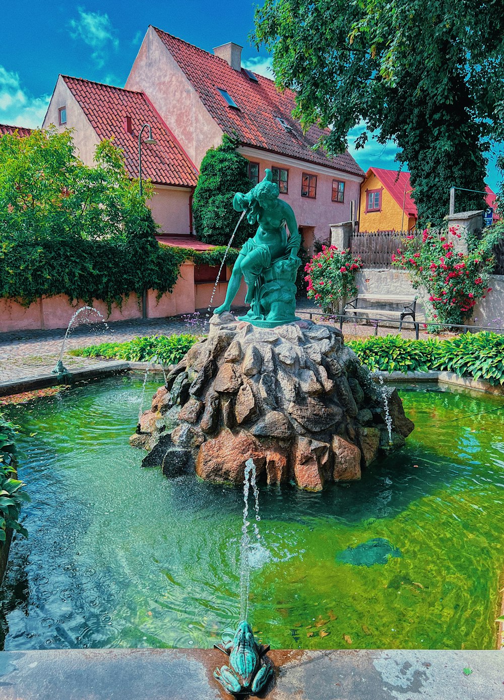 a fountain with a statue on top of it