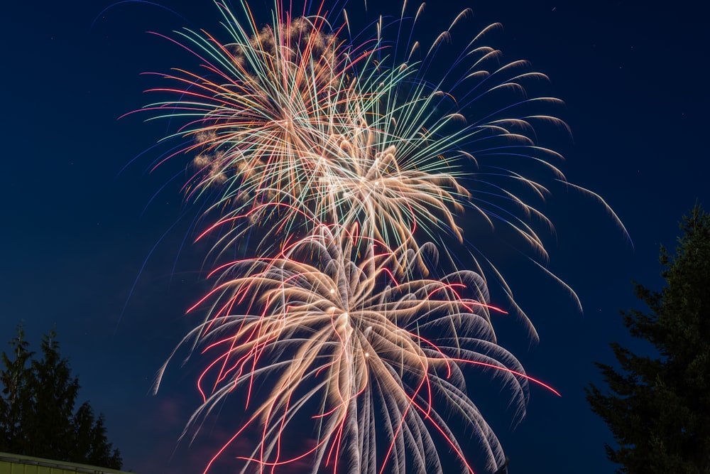 a colorful fireworks display in the night sky