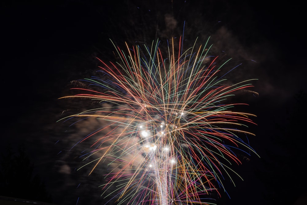 a colorful fireworks display in the night sky