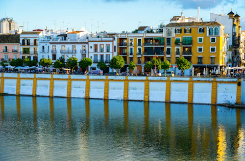 a body of water with buildings in the background