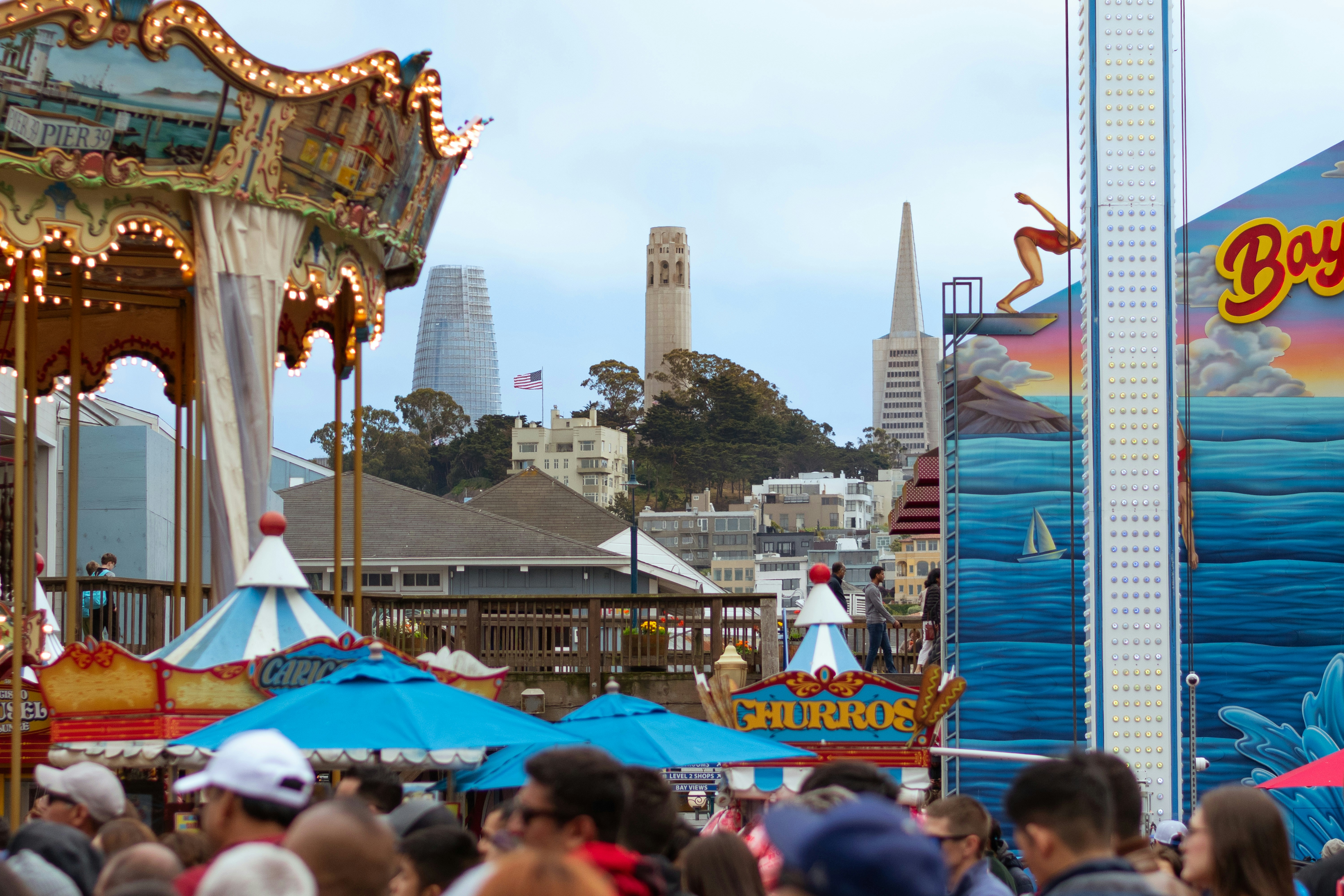 a group of people standing around a carnival