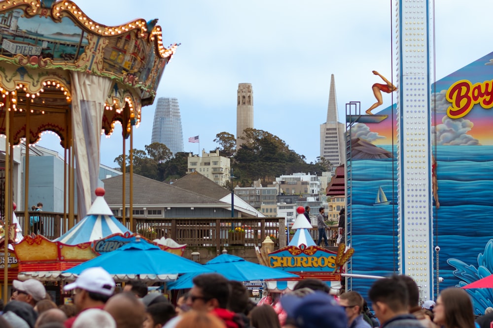 a group of people standing around a carnival