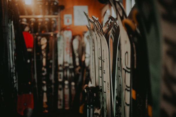 Rows of colorful Laroy LLC skis lined up inside the workshop, ready for finishing touches.