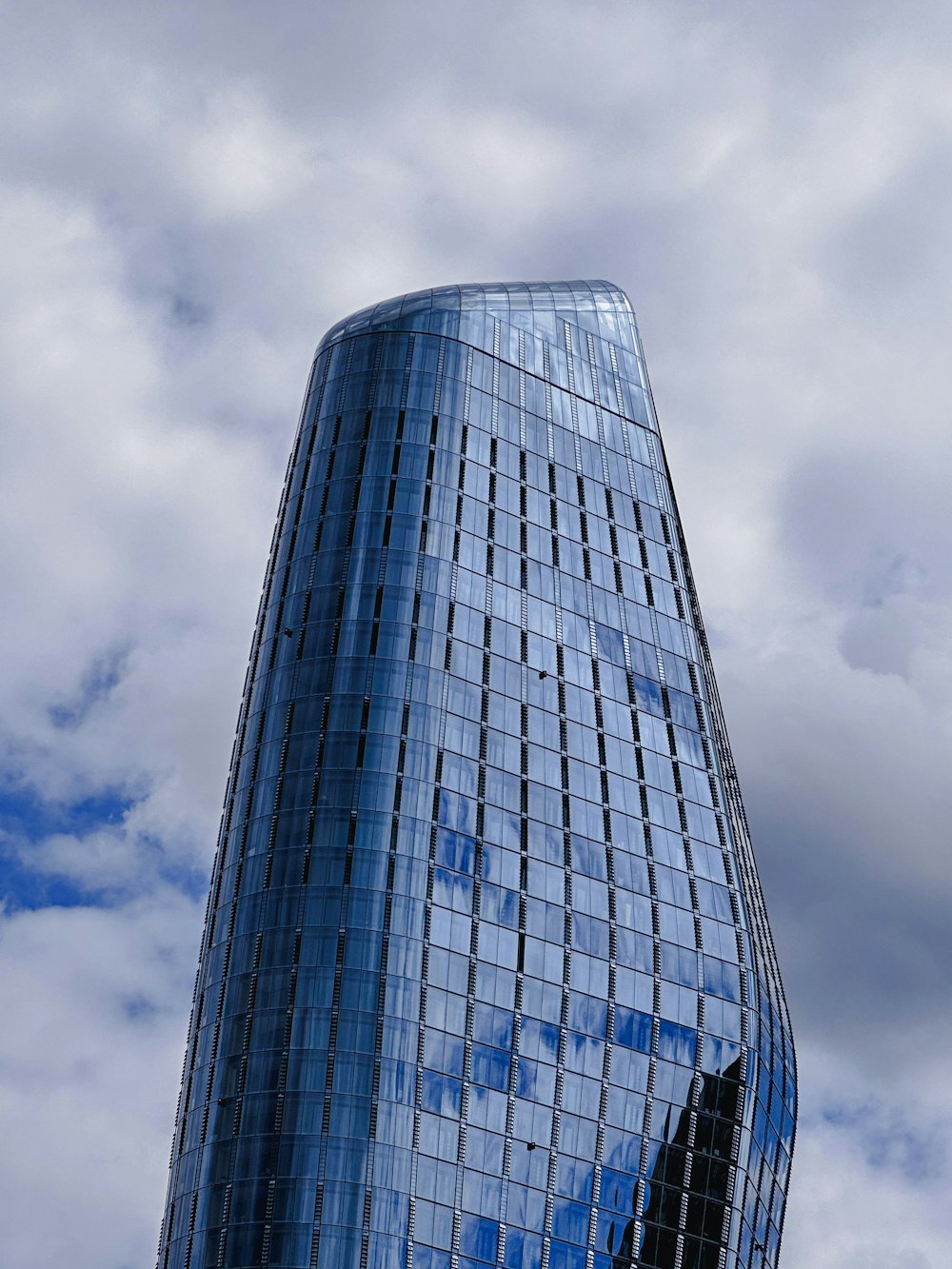 a very tall building with a sky background