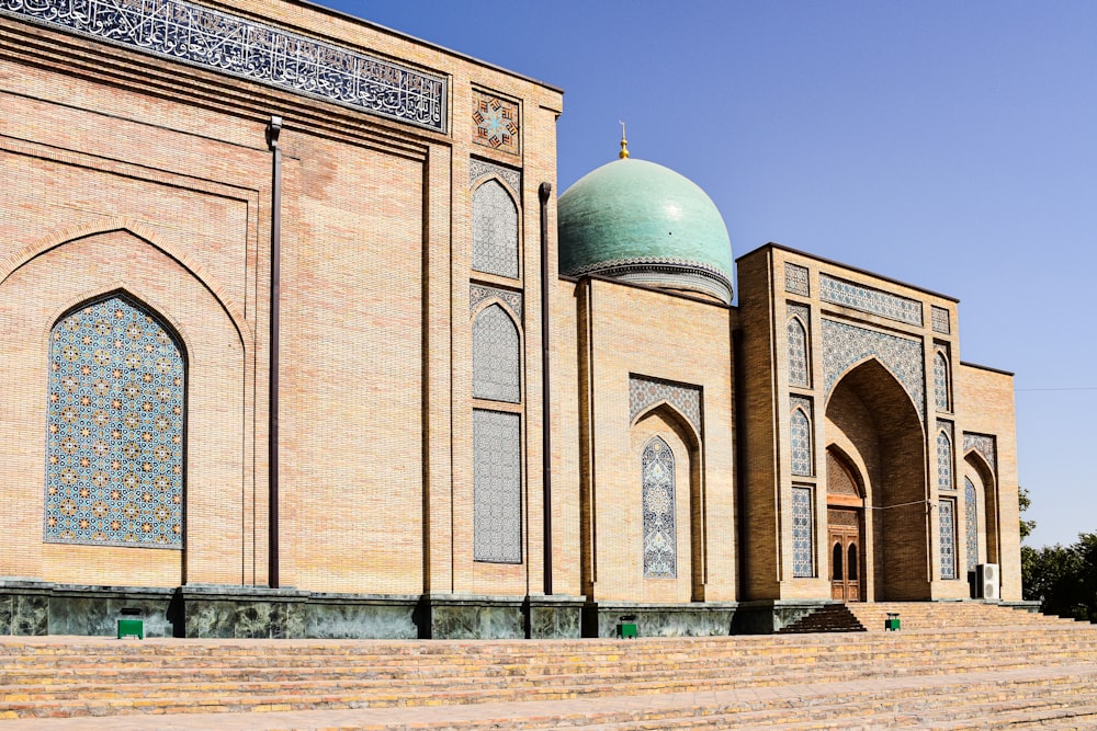 a large building with a green dome on top of it