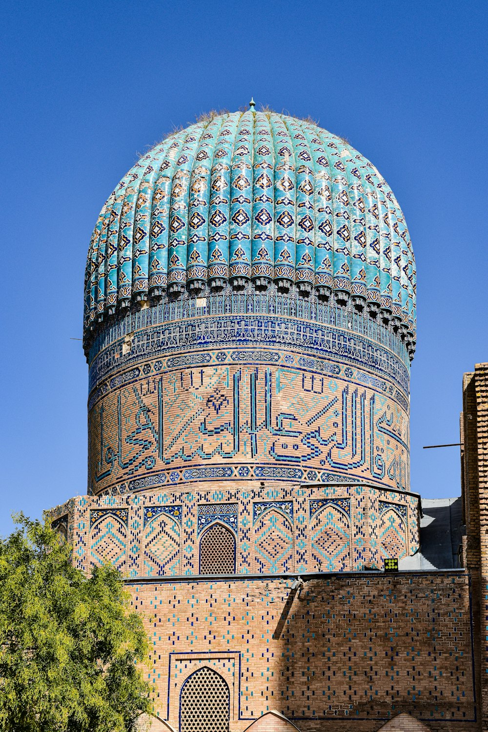 the dome of a building with a blue sky in the background