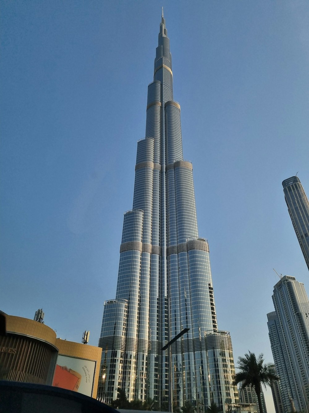 a very tall building towering over a city