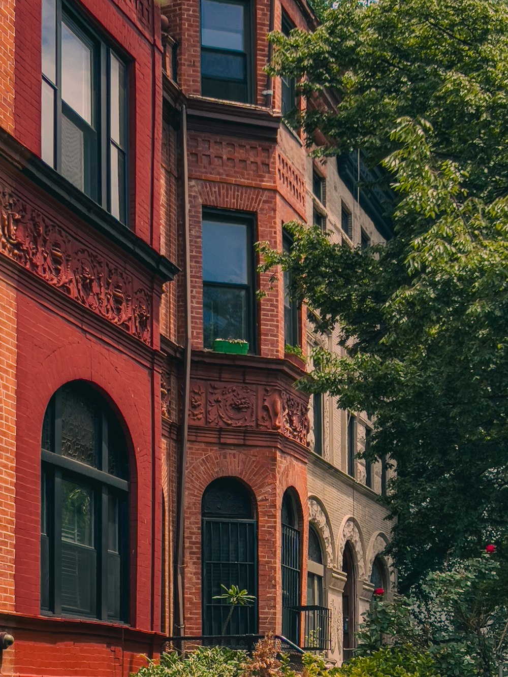 a red brick building with a clock on the front of it