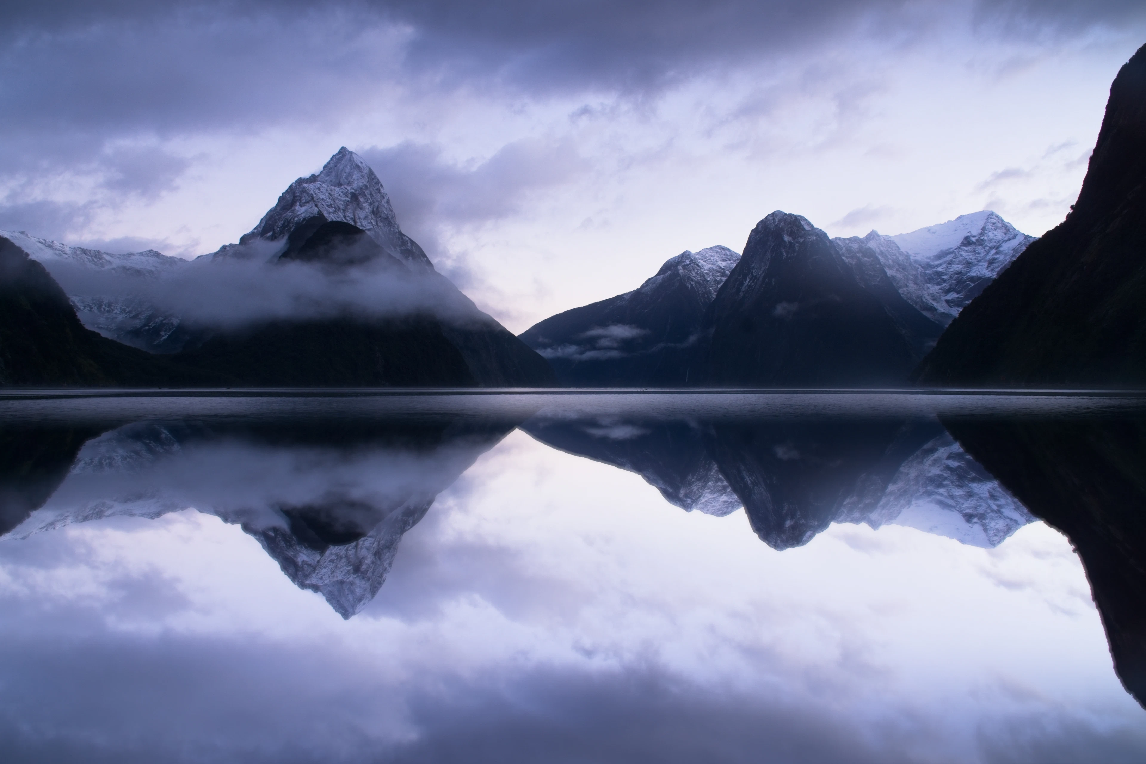 Mitre Peak mirrored in the still water of Milford Sound