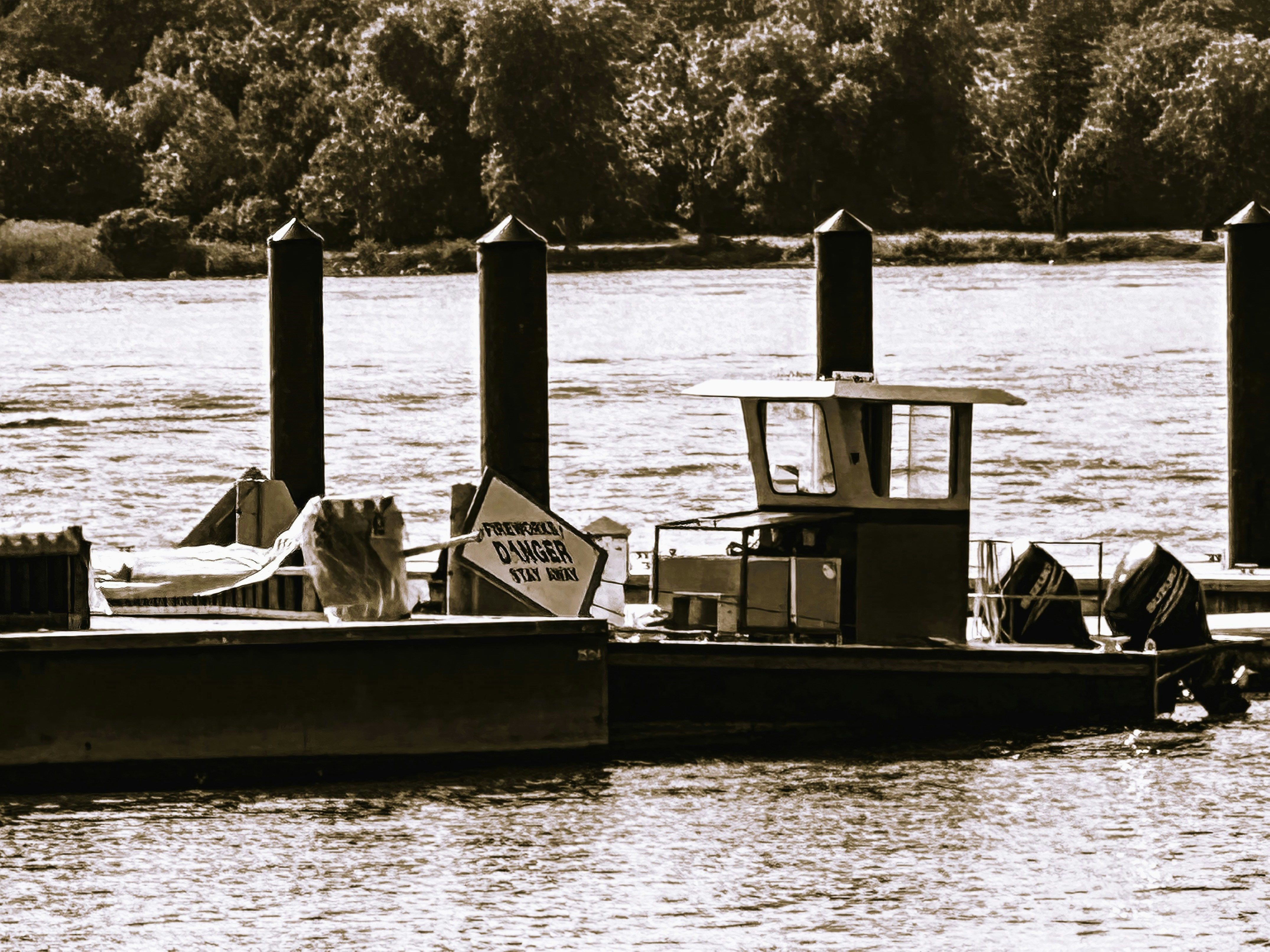 a black and white photo of a boat in the water