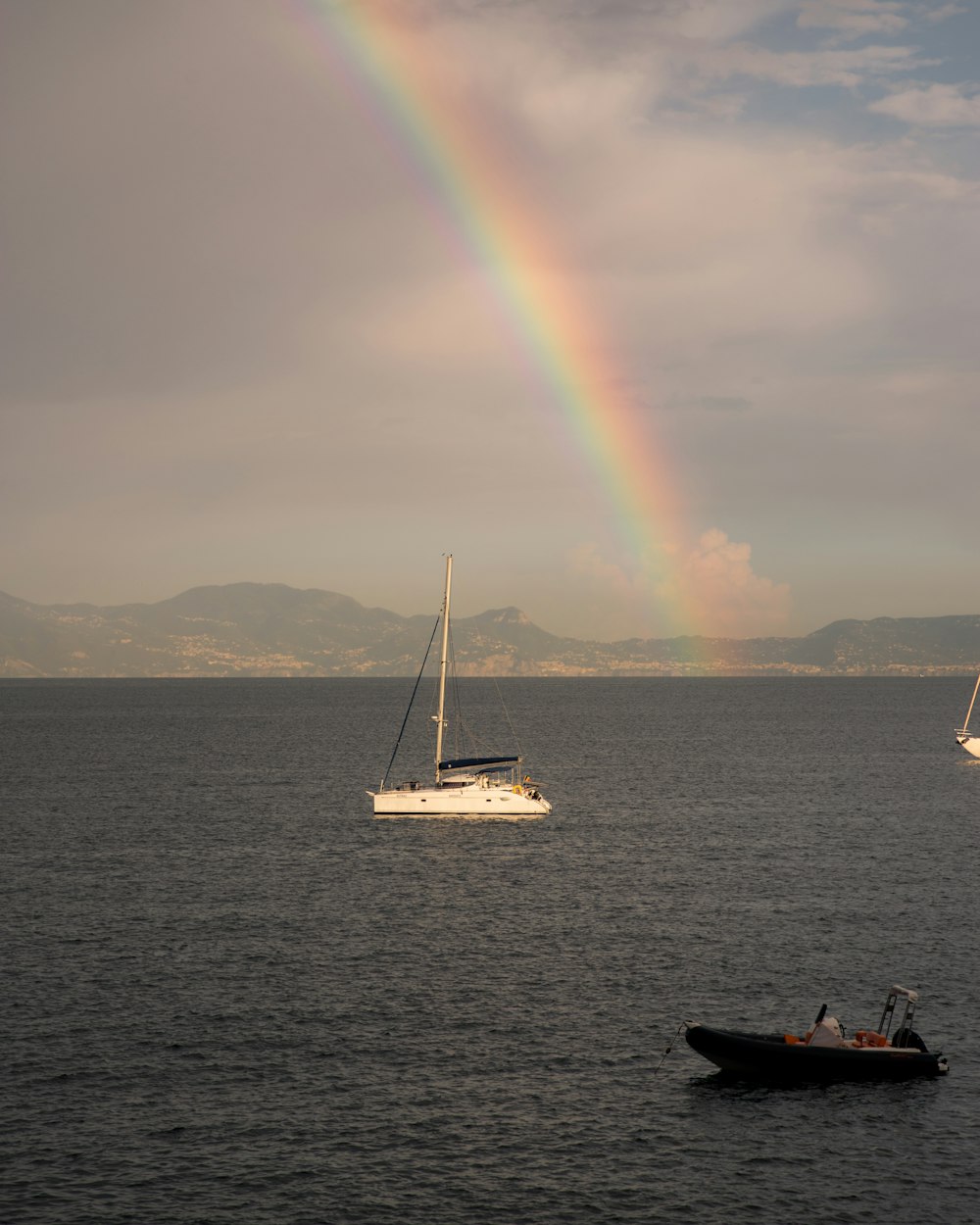 a rainbow in the sky over a body of water