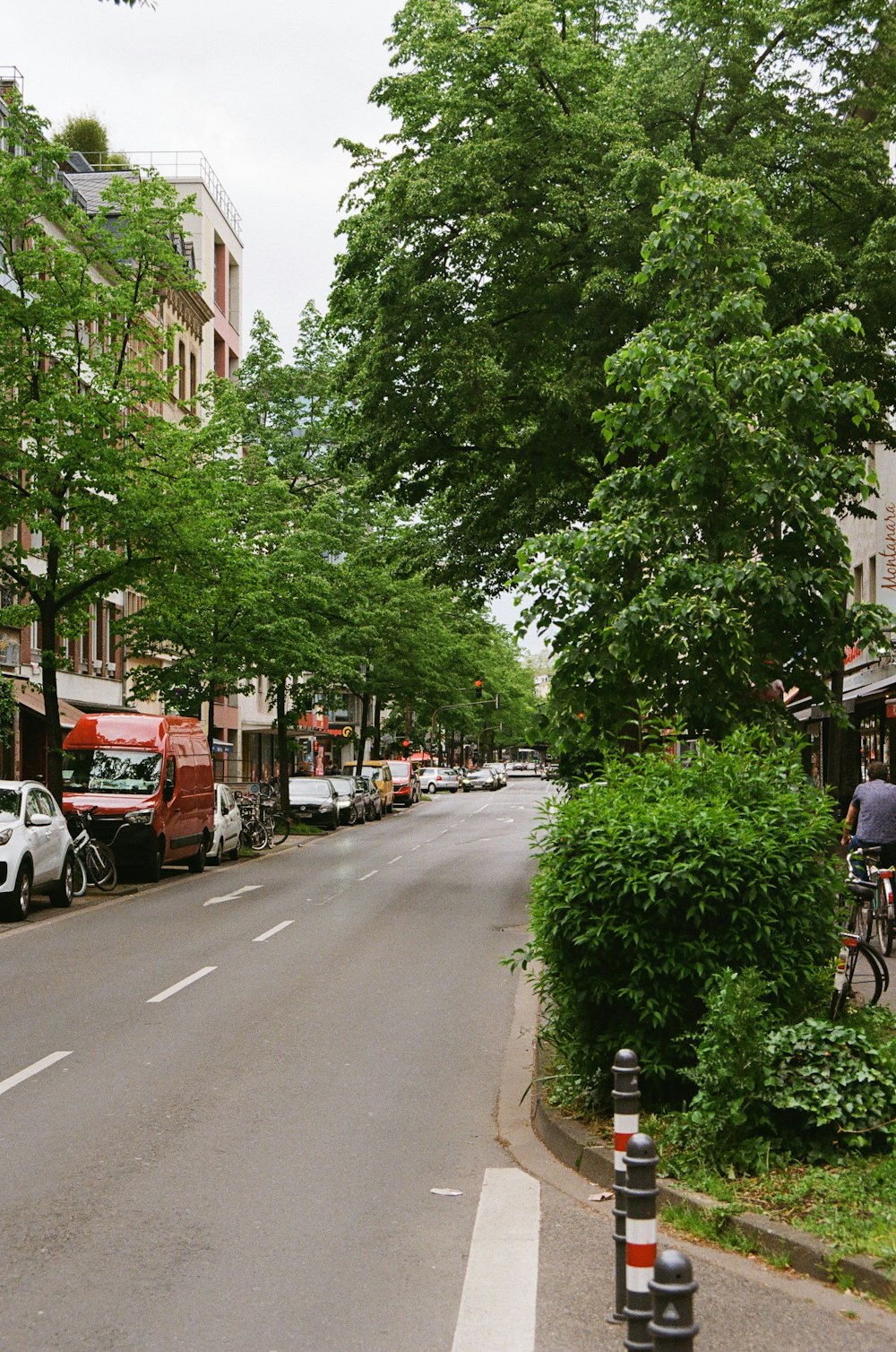 a street with cars parked on the side of it