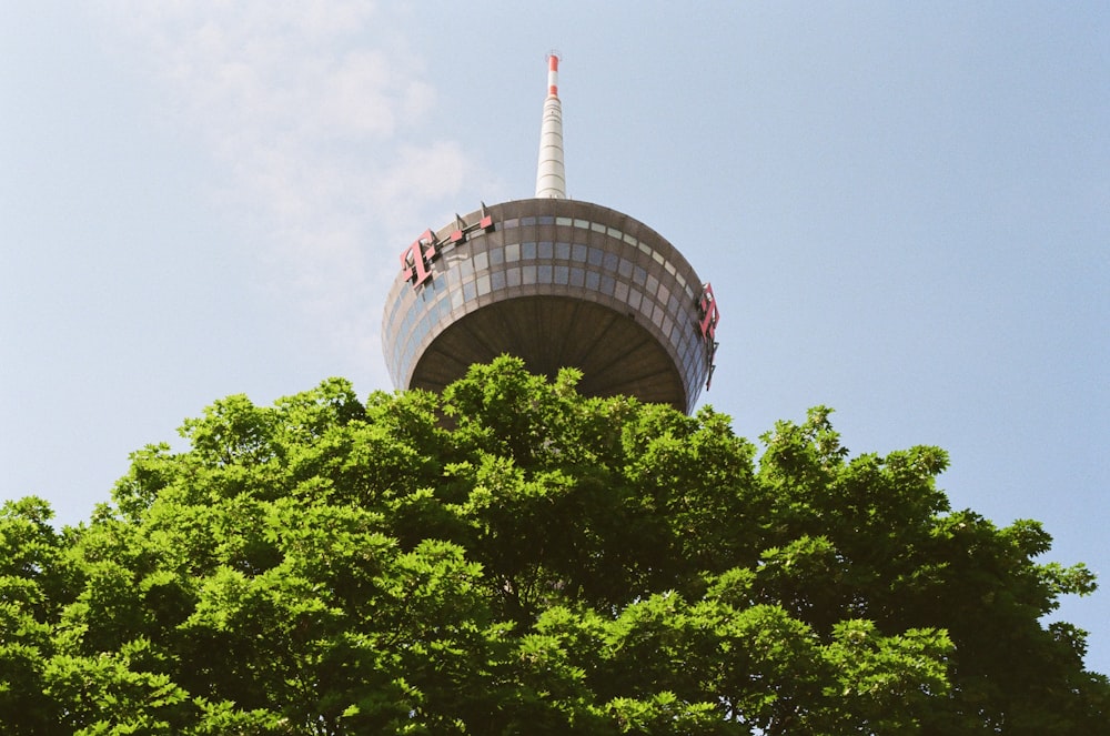 a tall tower with a clock on the top of it