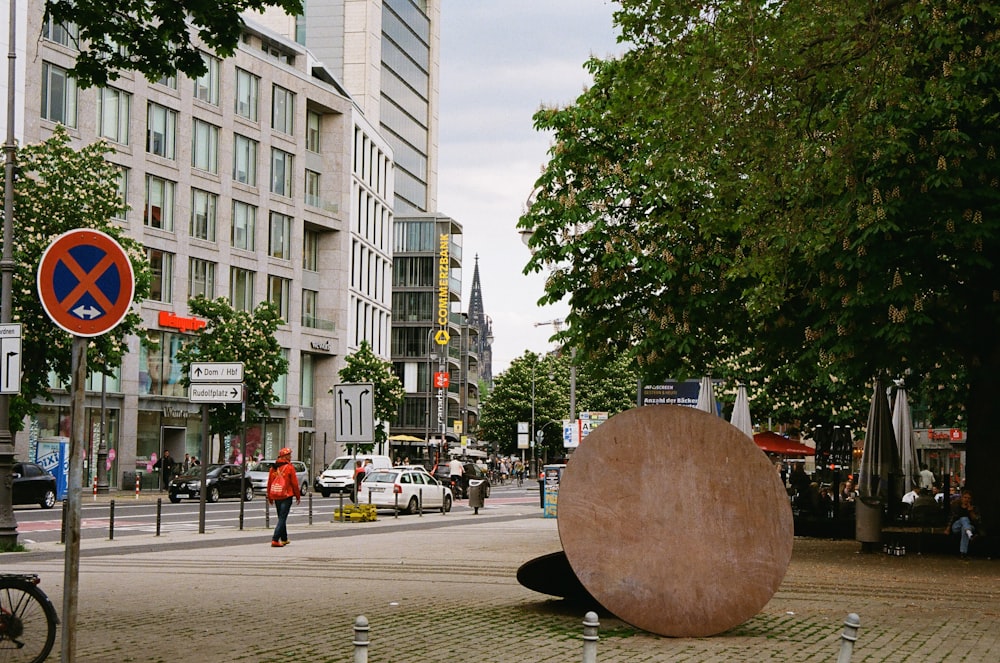 a large rock sitting on the side of a road