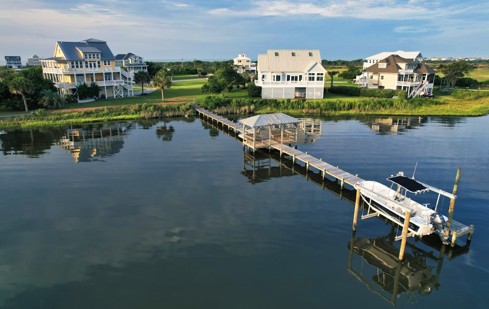 a boat is docked at the end of a pier