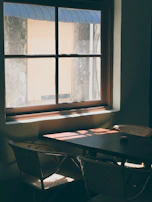A cozy scene with a matera and mate on a table next to a window with soft daylight.