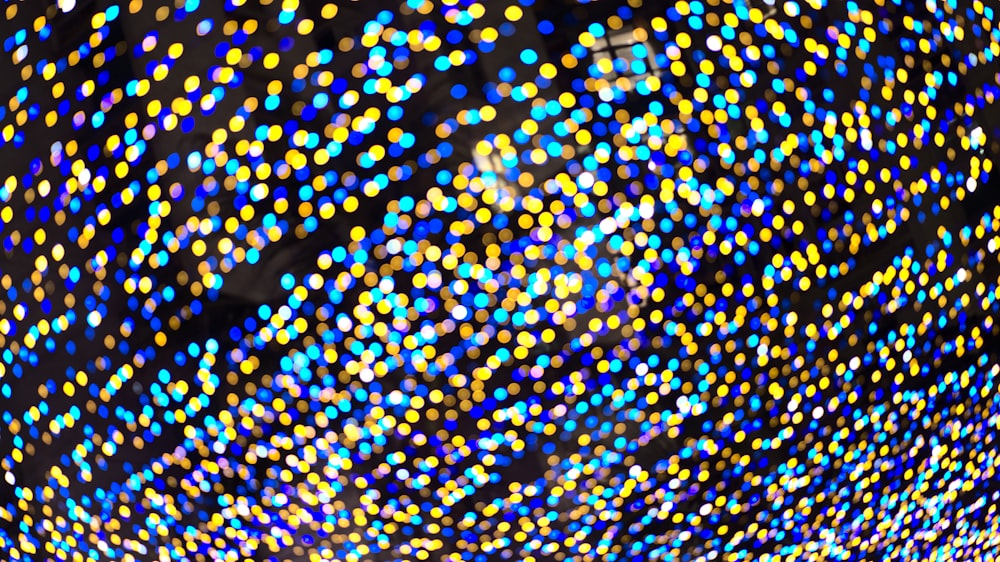a large ball of colorful lights on a black background