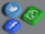 Three three-dimensional icons representing popular social media platforms are arranged against a neutral background. The icons have an embossed look, featuring a blue bird, a blue letter 'f', and a green phone symbol.