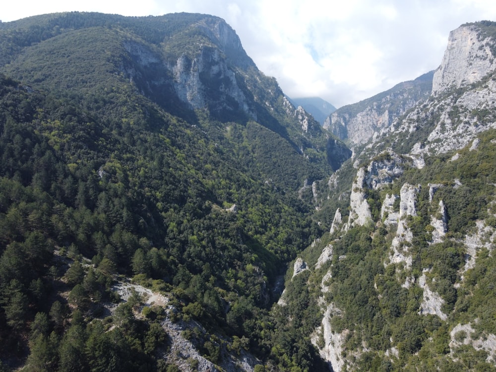 a view of a mountain with a river running through it