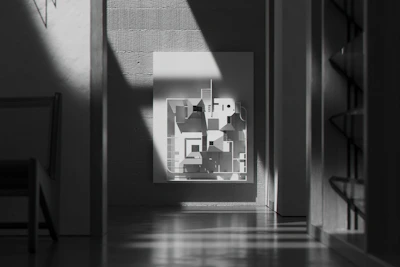 Close-up of an original artwork by an emerging artist displayed in a minimalist urban apartment.