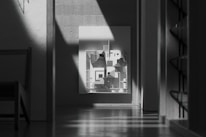 Contemporary interior with monochrome furniture and natural light.