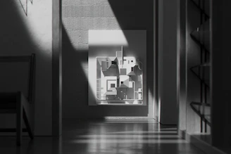 Close-up of an original artwork by an emerging artist displayed in a minimalist urban apartment.