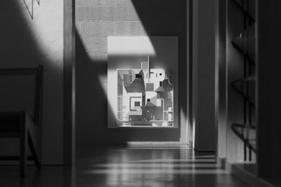 Contemporary interior with monochrome furniture and natural light.