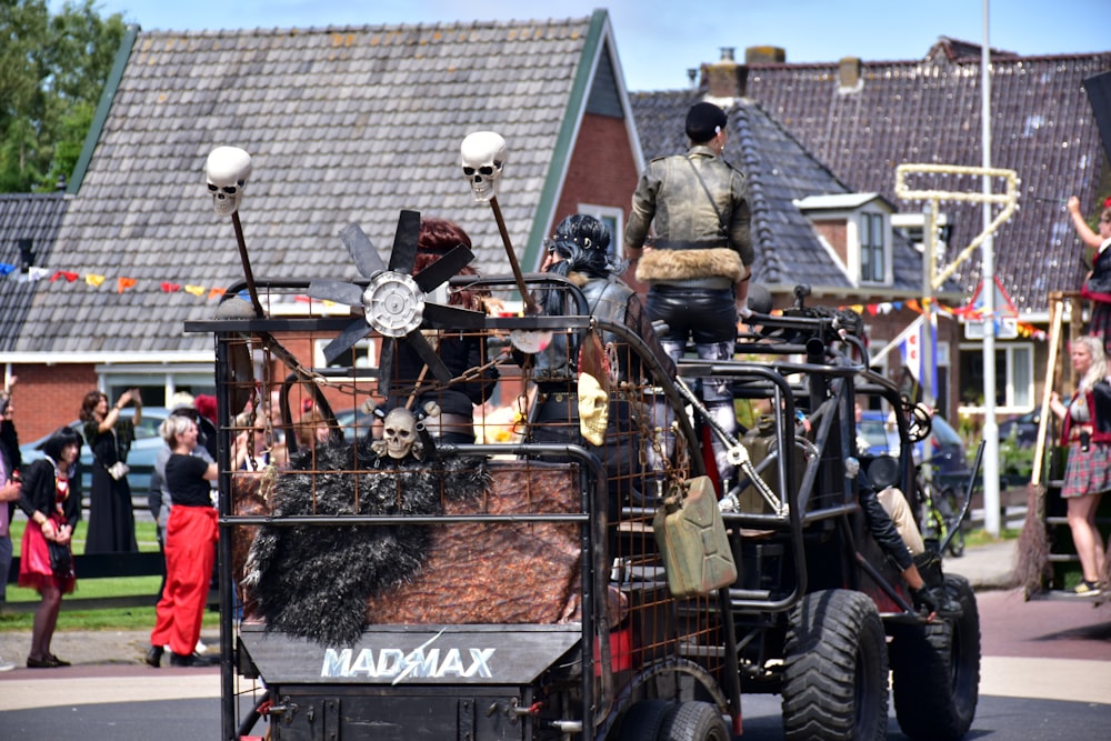 a parade float with a man riding in the back of it