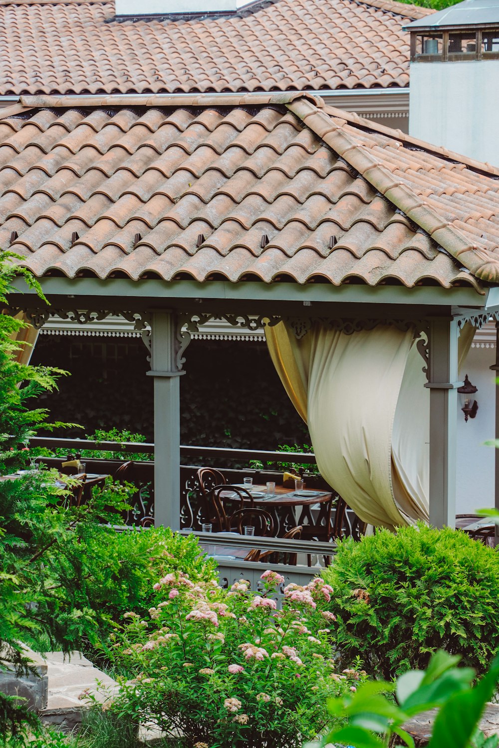 a gazebo with a canopy in a garden