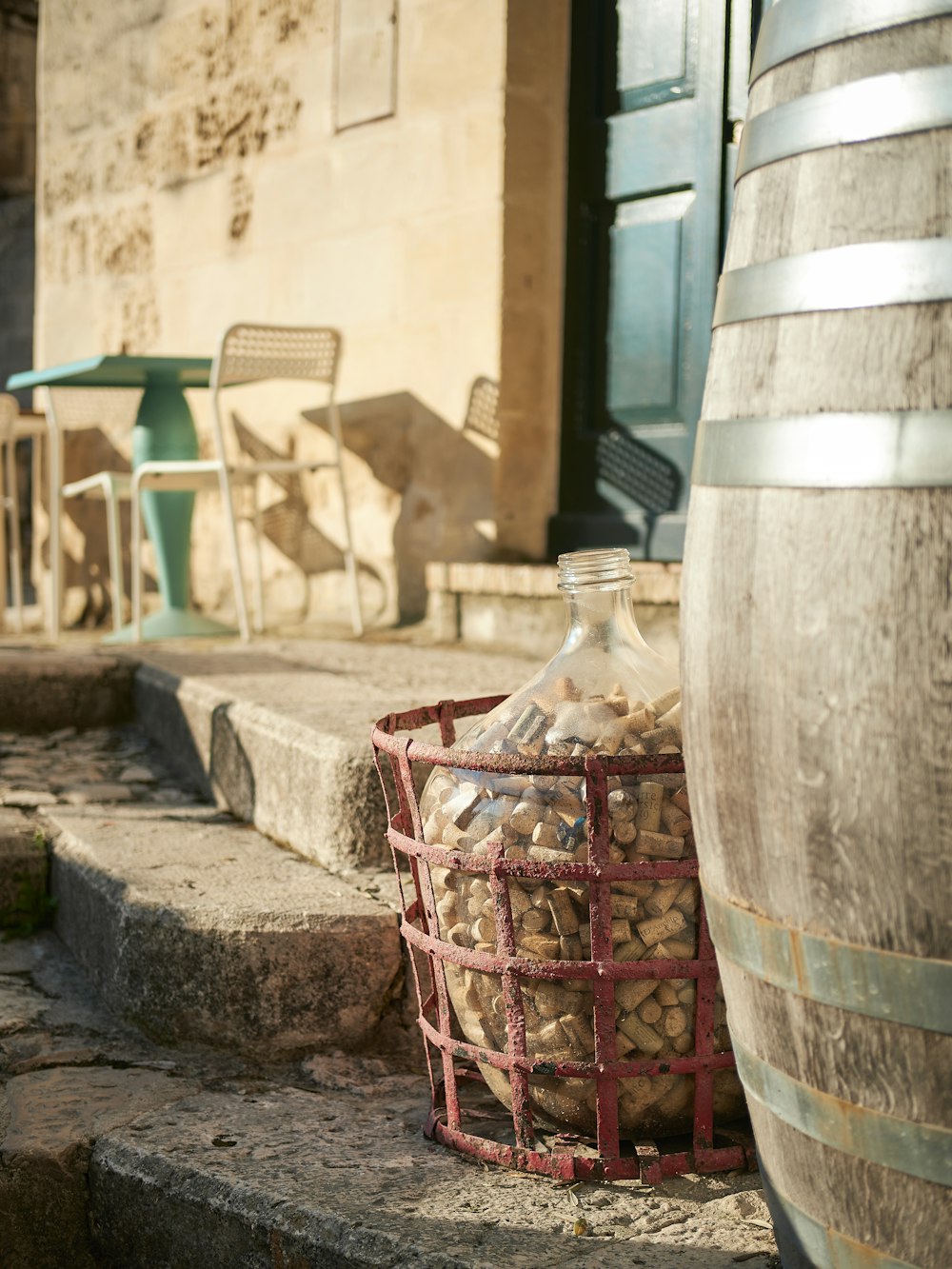 a basket full of wine corks next to a barrel