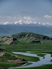 a mountain range with a river running through it