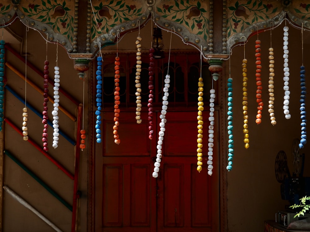 a bunch of beads hanging from a ceiling