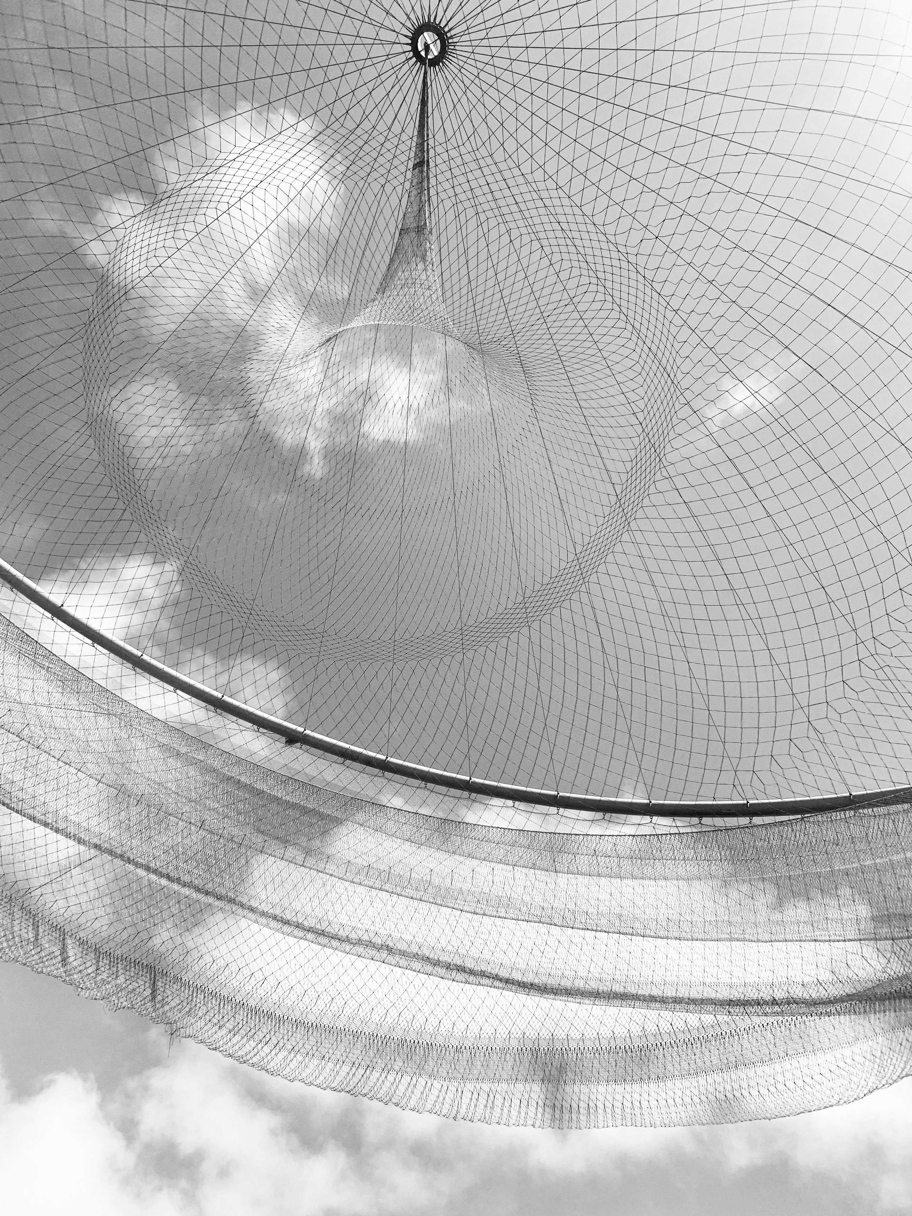 a black and white photo of a large net