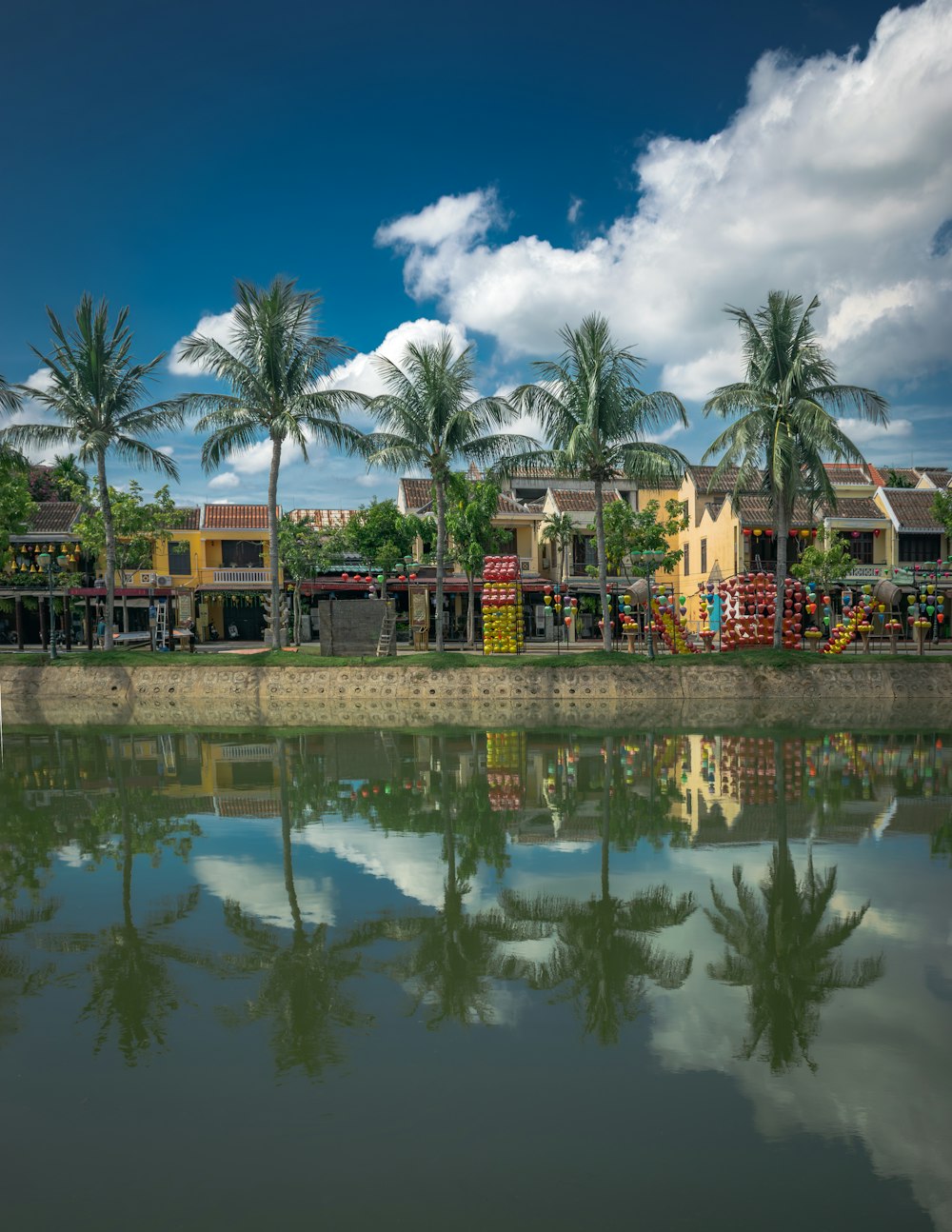 a body of water surrounded by palm trees